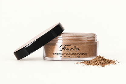 Teacup Cosmetics Finishing Veil Loose Powder shade 111 Golden Bronze with front-right loose powder spill